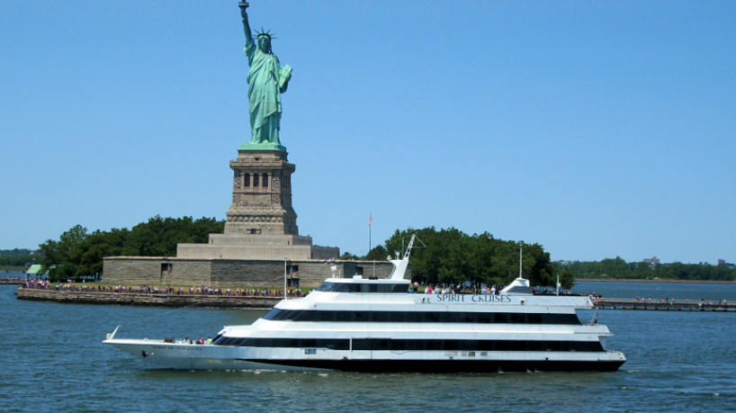 Spirit Cruises yacht sailing near the Statue of Liberty.